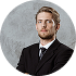 Male Financial Advisor In Modern Office Sitting At Desk Working On Laptop-4