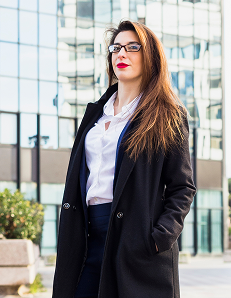 business-woman-black-jacket-standing-outside 1