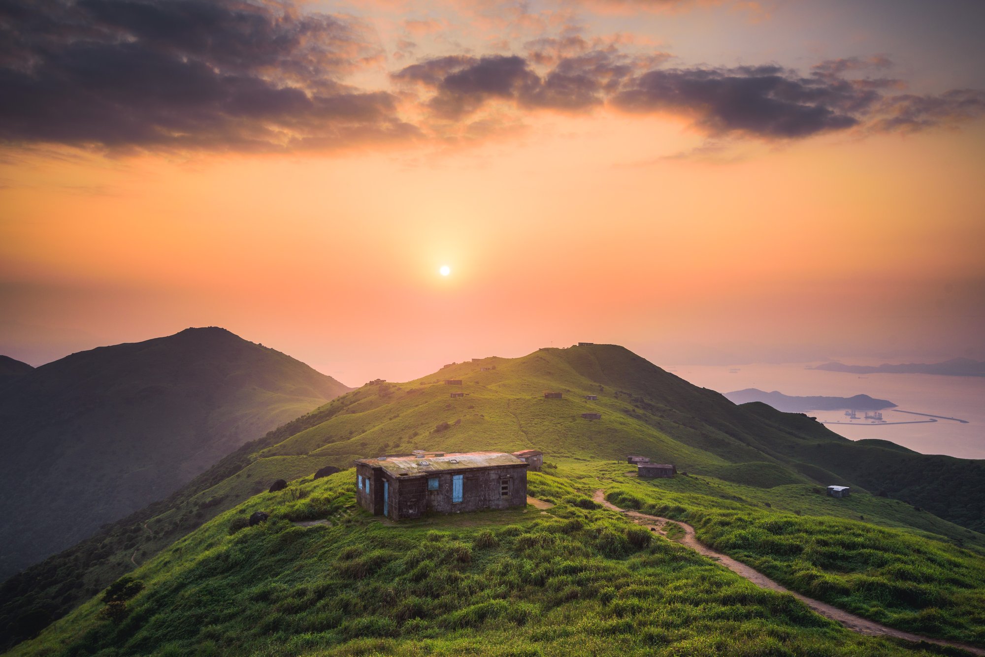 small-house-built-peaceful-green-hill-high-up-mountains